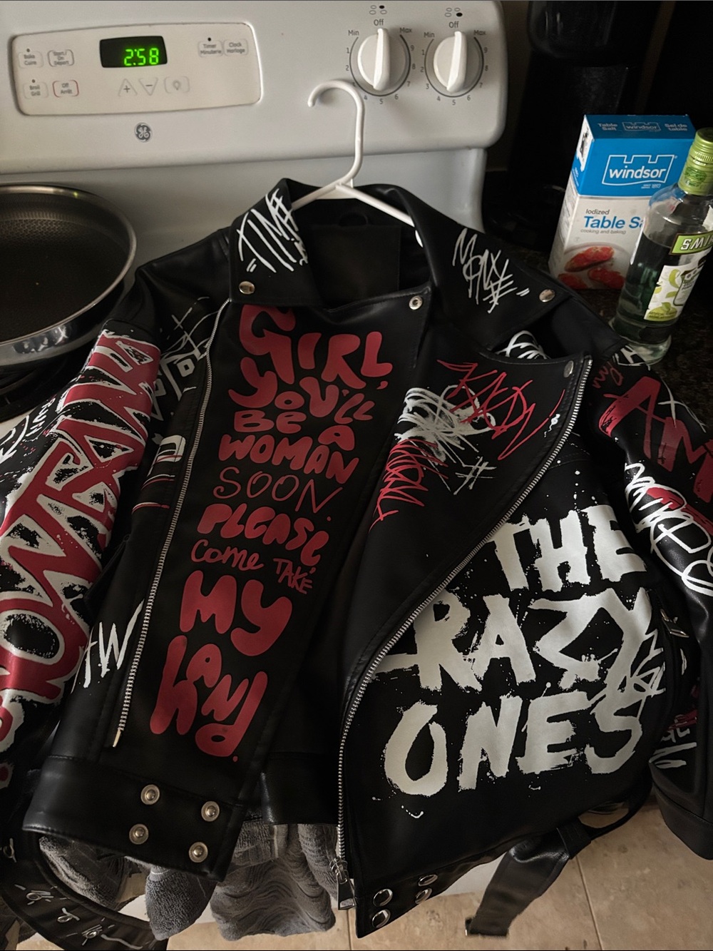 Graphic Black Leather-Style Biker Jacket with Red & White Slogan Art